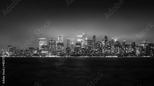 View from Liberty State Park in New Jersey of the New York City Cityscape at Night on a Foggy Day in Black and White photo