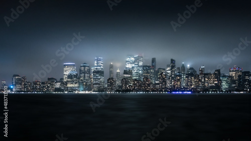 View from Liberty State Park in New Jersey of the New York City Cityscape at Night on a Foggy Day photo