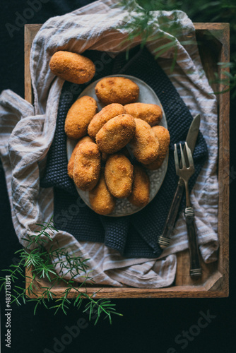 Potato croquettes served in a rustickitchen photo