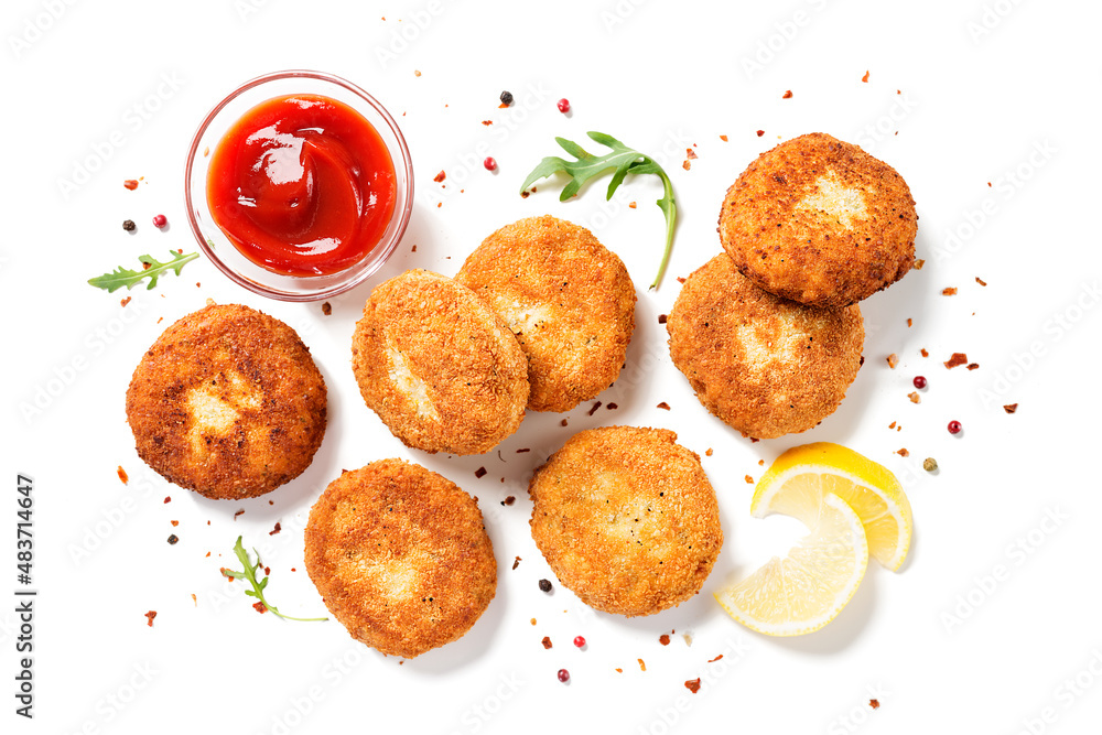 Chicken patties or fish cakes fried in breadcrumbs with ketchup and lemon slices. isolated on white background, top view - obrazy, fototapety, plakaty 