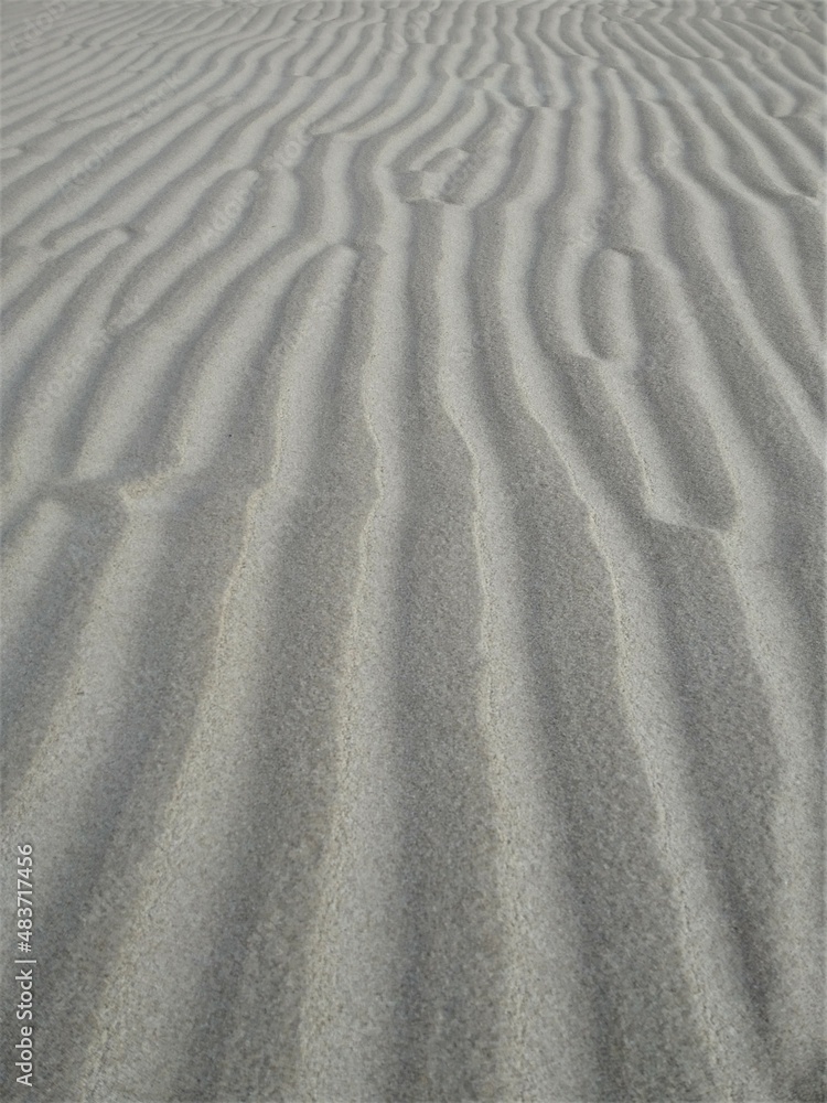 Fototapeta premium drawing of dunes on the beach sand