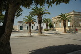 Acaia, Lecce. Veduta di case del centro con palme