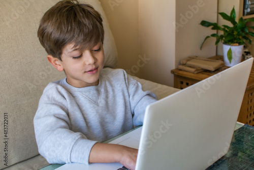Photographie Young Caucasian Boy Using Laptop