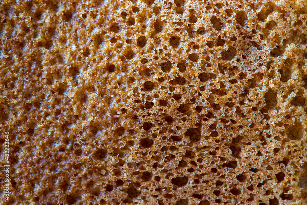 High resolution brown bread texture background. Texture of brown bread baked from rye flour High resolution brown bread texture background. Texture of brown bread baked from rye flour