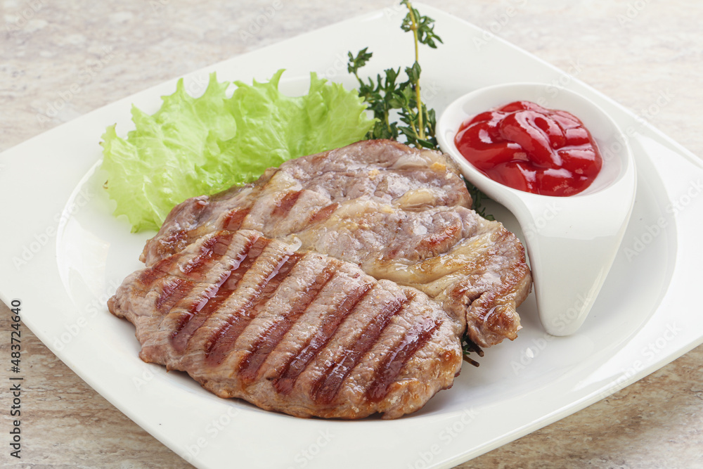 Grilled pork neck steak with ketchup