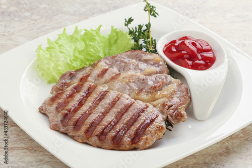 Grilled pork neck steak with ketchup