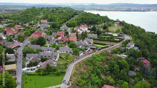 Cinematic 4K aerial drone footage of the charming historic village and open air museum of Tihany on the shores of Lake Balaton photo