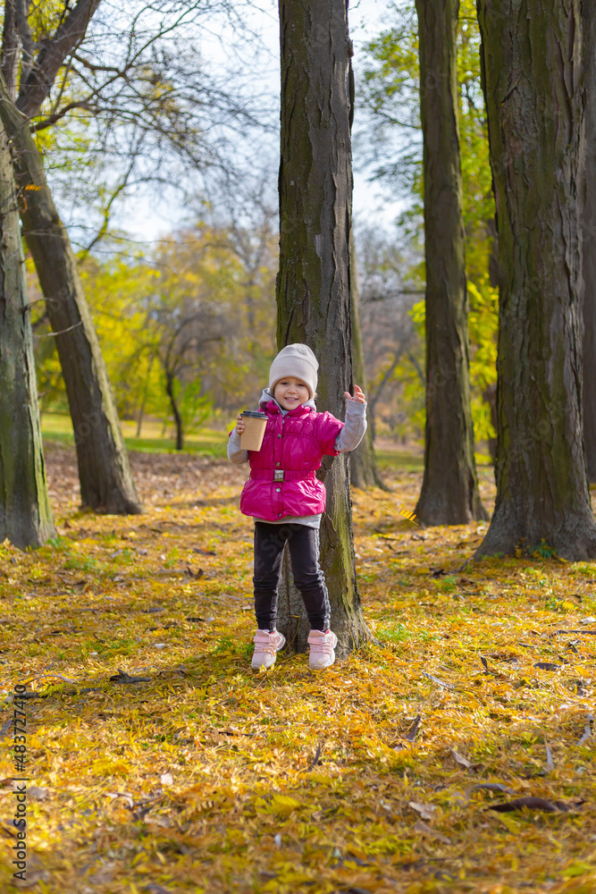 Happy little girl in the park. Autumn season. Happy little girl in the park. Autumn season.