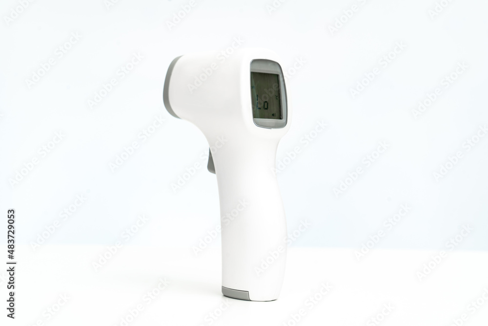 contactless electronic thermometer on a white background. measuring device for measuring body temperature. home medicine cabinet. sale of medical products for home use. contactless electronic thermometer on a white background. measuring device for measuring body temperature. home medicine cabinet. sale of medical products for home use.