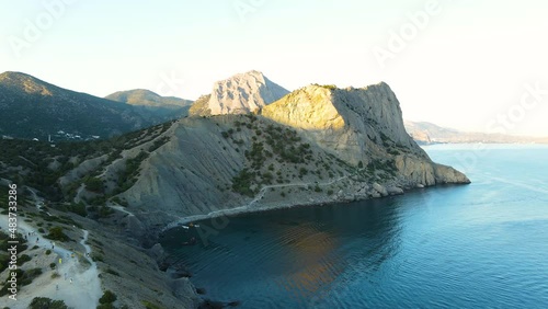 Departure from the mountain over the sea at sunset photo