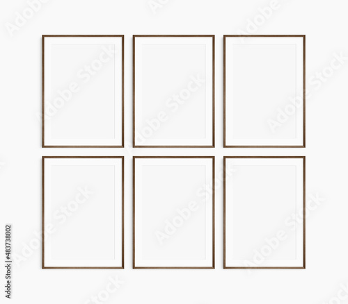 Frame mockup 5x7, 50x70, A4, A3, A2, A1. Set of six thin dark brown walnut wood frames. Gallery wall mockup, set of 6 frames. Clean, modern, minimalist, bright. Portrait. Vertical. Mat opening 2:3.