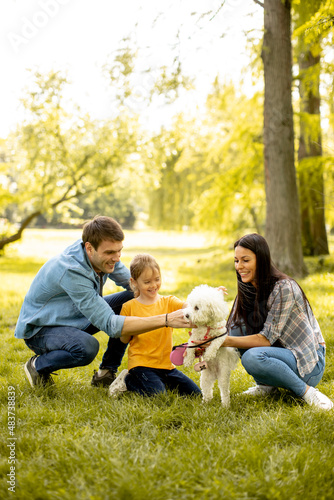 Happy family with cute bich...
