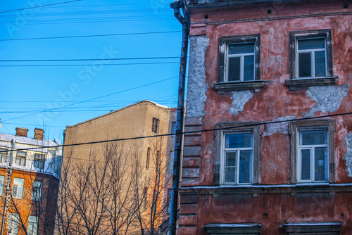 old houses in St. Petersburg, windows are close, pigeons flying
