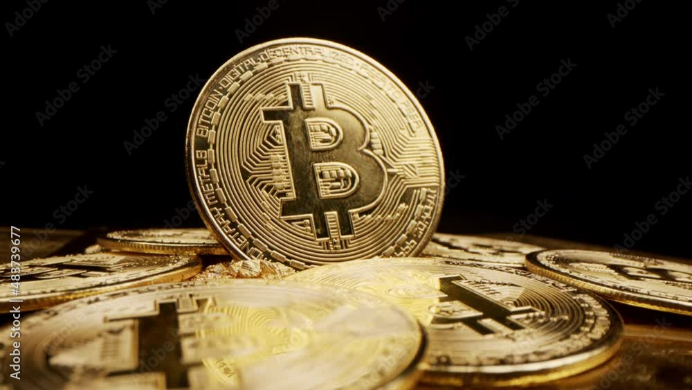 Bitcoin Crypto currency Gold Bitcoin BTC Bit Coin close up of Bitcoin coins isolated on black background Blockchain technology, bitcoin mining concept 3d rendering
