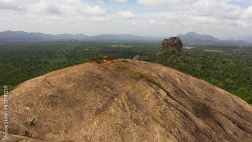 Aerial drone of Sigiriya Rock with a fortress and Pidurangala rock is a famous tourist place in Sri Lanka. photo