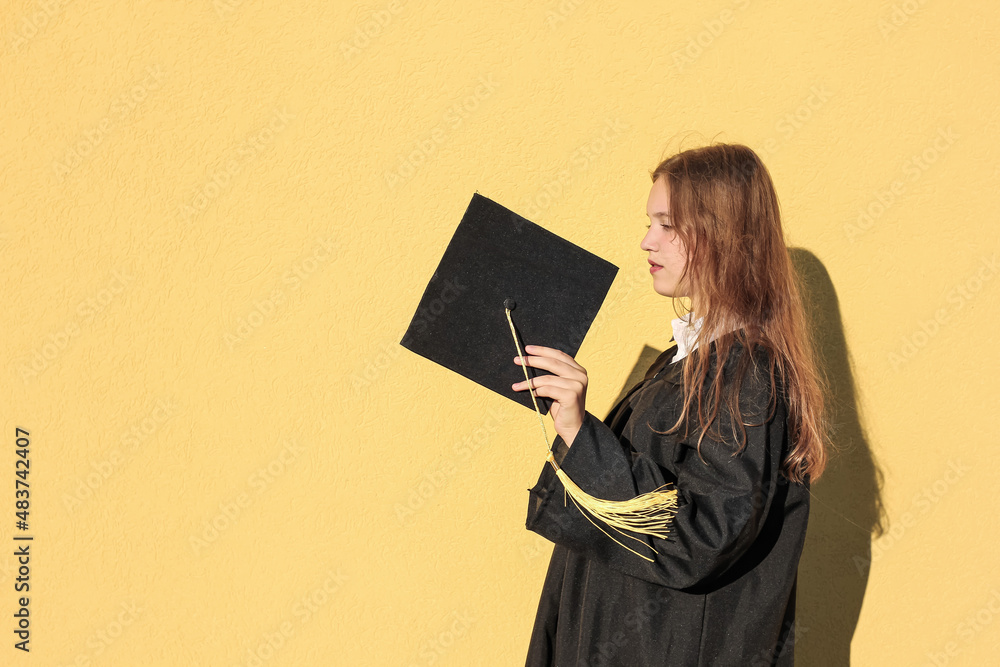 Cute teenage graduate girl laughing and having fun. No school, back to school concept. Graduation. Education. Cute teenage graduate girl laughing and having fun. No school, back to school concept. Graduation. Education.