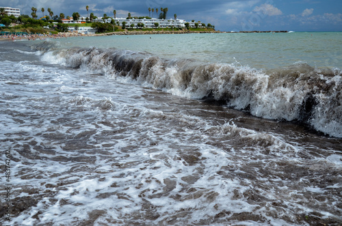 sea storm on sand beach 