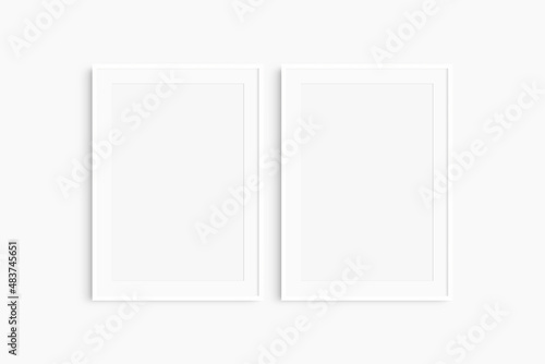 Frame mockup 5x7, 50x70, A4, A3, A2, A1. Set of two thin white frames. Gallery wall mockup, set of 2 frames. Clean, modern, minimalist, bright. Portrait. Vertical. Mat opening 2:3.