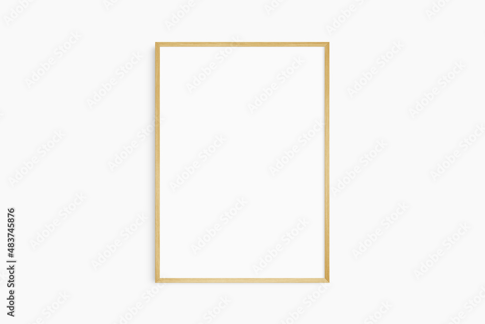 Obraz premium Frame mockup 5x7, 50x70, A4, A3, A2, A1. Single oak wood frame mockup. Clean, modern, minimalist, bright. Portrait. Vertical.