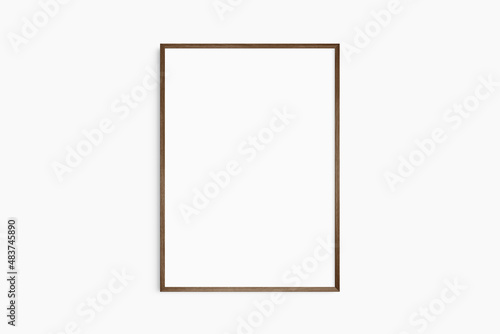 Frame mockup 5x7, 50x70, A4, A3, A2, A1. Single dark brown walnut wood frame mockup. Clean, modern, minimalist, bright. Portrait. Vertical.