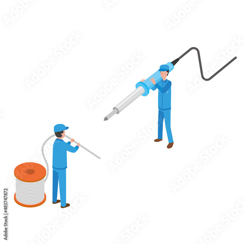 はんだづけ作業をする作業員