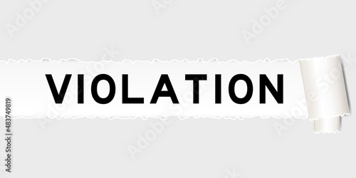 Ripped gray paper background that have word violation under torn part