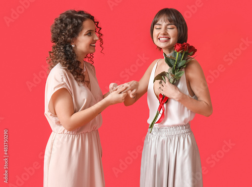 Young lesbian woman proposi...