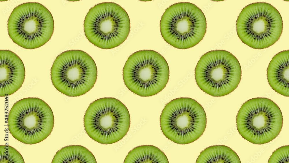 Minimal motion design - Kiwi slices moving down at yellow color background. Trendy colors and style graphics. Seamless looping animation. Minimal motion design - Kiwi slices moving down at yellow color background. Trendy colors and style graphics. Seamless looping animation.