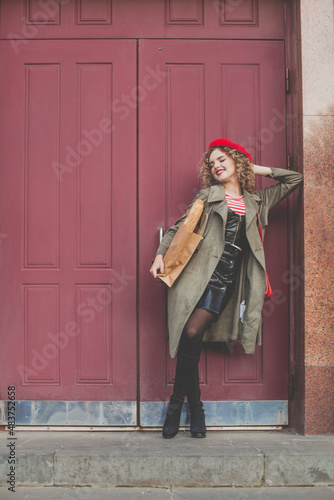 Beautiful woman with curly hair walking in the city