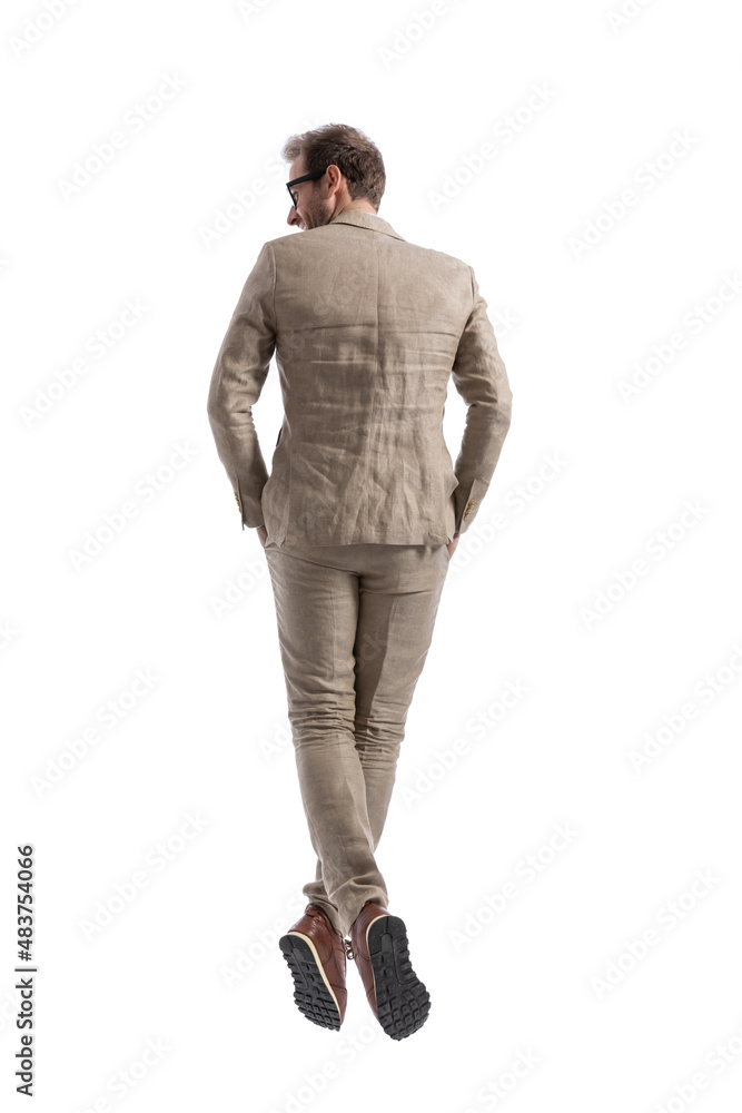 young businessman posing with his hands in pockets young businessman posing with his hands in pockets