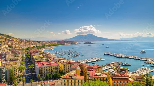 Naples, Italy. View of the Gulf of Naples from the Posillipo hill with Mount Vesuvius far in the background. Boats coming in and out to the city marina. 4K Time lapse video.