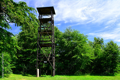 Lookout wooden tower for tourists on the top of the Kralova Studna peak in Beskidy mountains. photo