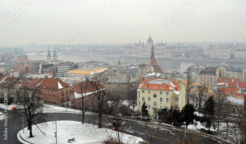 Budapest city view with famous Parliament building on horizon in misty morning