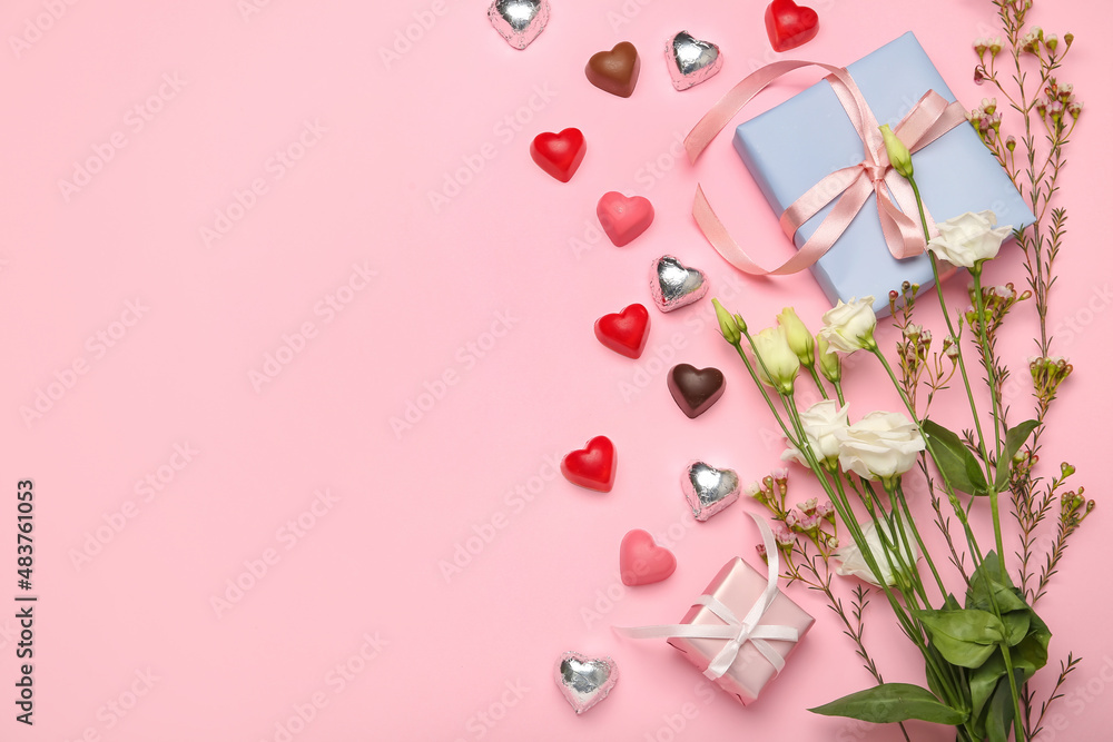 Composition with tasty heart-shaped candies and flowers for Valentine's Day celebration on pink background