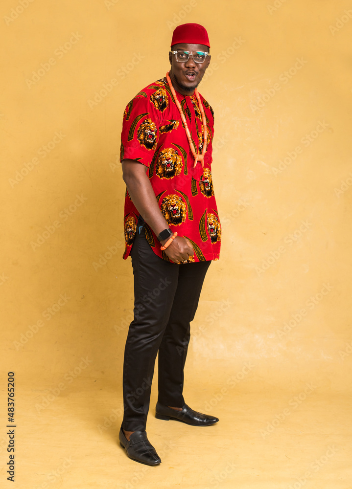Igbo Traditionally Dressed Business Man Standing and Smiling Igbo Traditionally Dressed Business Man Standing and Smiling