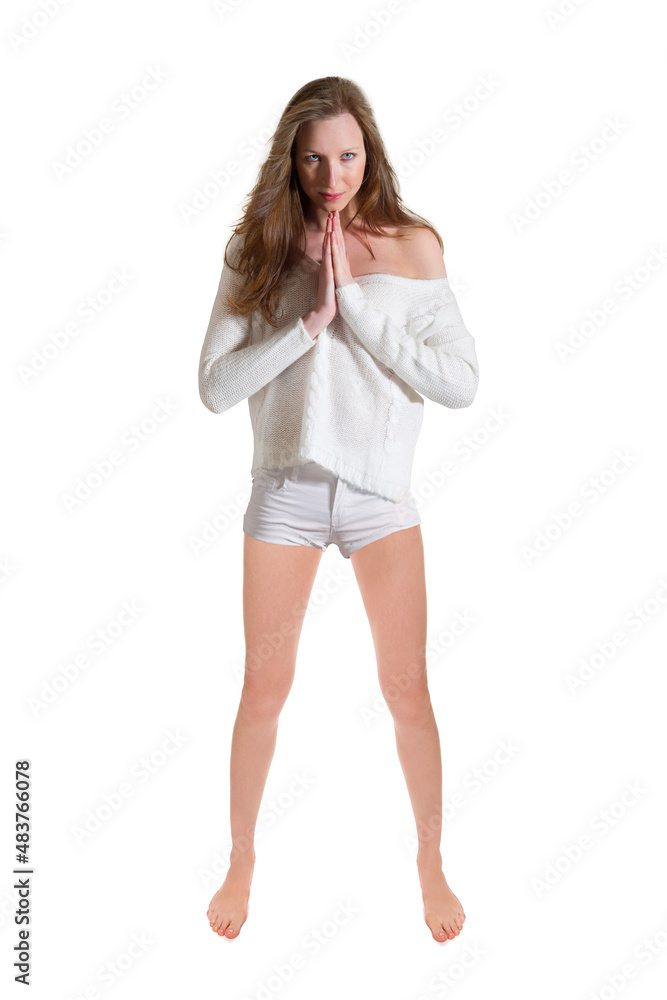 Full length portrait of a slim young woman with her hands folded, she is wearing white shorts and a pullover, isolated on white studio background Full length portrait of a slim young woman with her hands folded, she is wearing white shorts and a pullover, isolated on white studio background