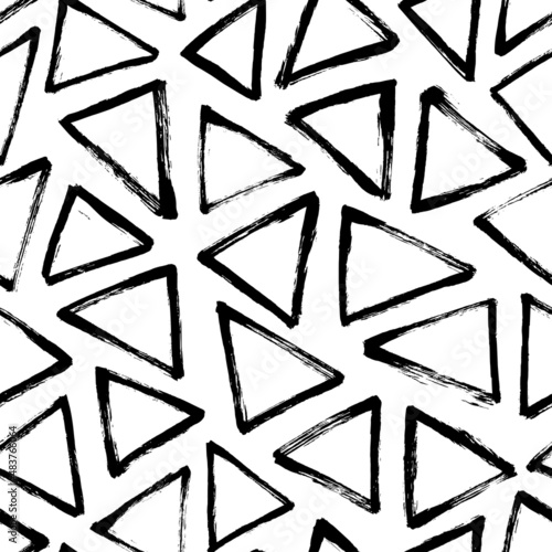 Brush paint ink triangle vector seamless pattern. Geometric grunge brush strokes. Distress black and white texture. Geometric background with abstract triangular forms. Modern grunge texture stamps. 
