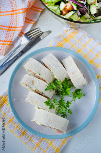 Salmon, avocado and cream cheese roll in lavash