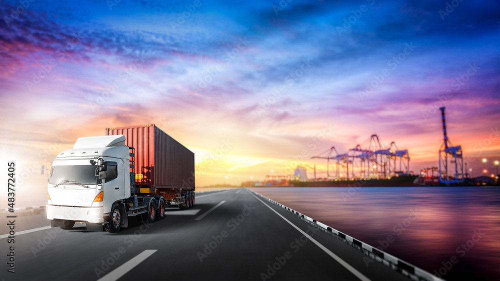 Global business logistics import export background of truck on highway, container cargo freight ship loading at port by crane, transportation Industry concept, Depth blur effect