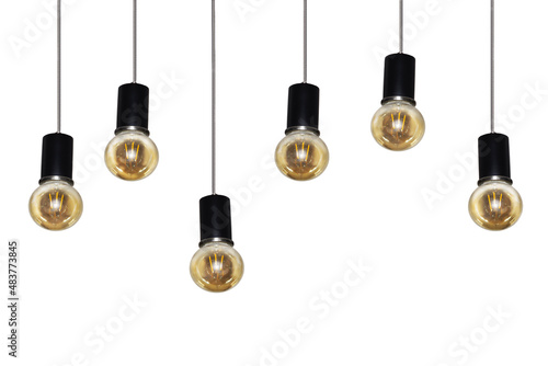 A row of electric light bulbs hangs on a wire on a white background.