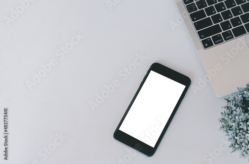 Mockup a mobile phone and computer laptop. Blank screen with text or image for an advertisement.