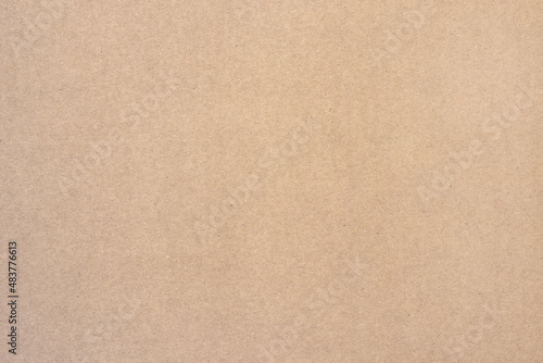 A sheet of brown cardboard. Paper natural texture.