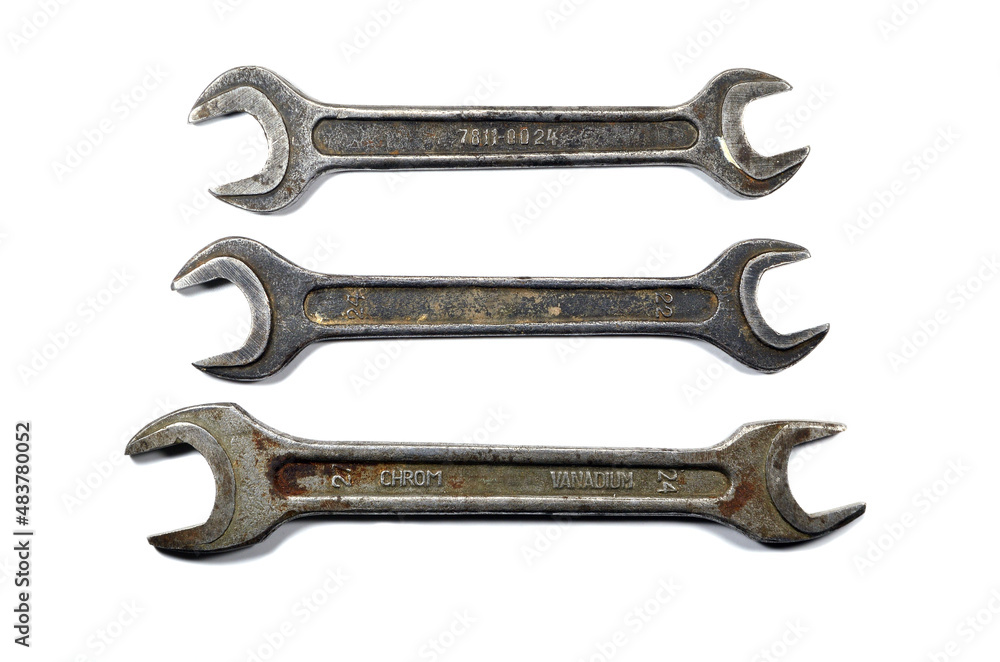 Old wrenches of different sizes isolated on a white background. Old wrenches of different sizes isolated on a white background.