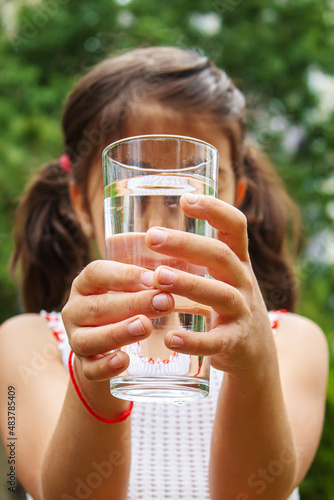 Child drinking pure water in nature.selectiv fokus