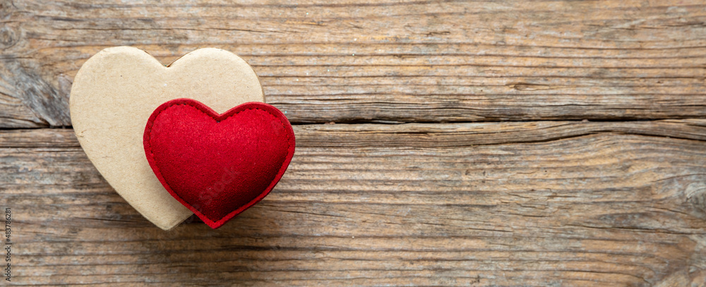 Valentine day felt texture heart on gift box, wooden background. banner Valentine day felt texture heart on gift box, wooden background. banner