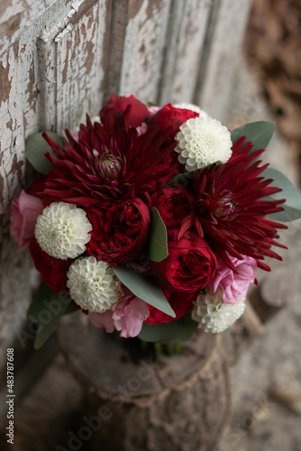 Wedding bouquet . The bride's bouquet. Bouquet of red flowers. Bridal douquet composed of dahlia and roses. photo