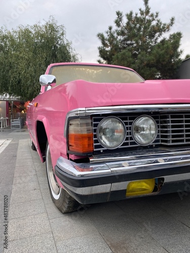 Vertical cropped shot of a gorgeous vintage pink auto