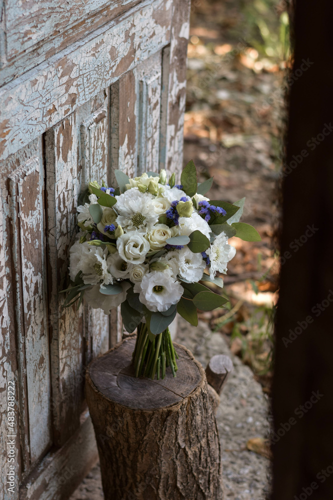 Wedding bouquet of white and blue flowers. Wedding day