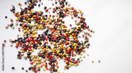 Candy multi-colored stones scattered on a white background