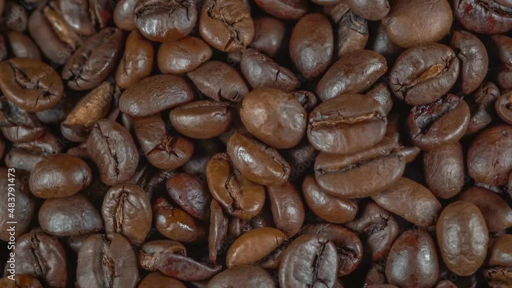 Roasted arabica coffee beans on background Roasted arabica coffee beans on background